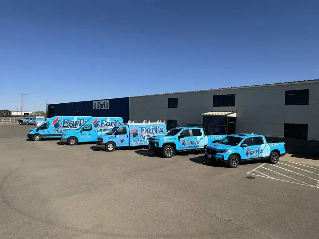 Earl's fleet trucks outside of shop in Lubbock, TX